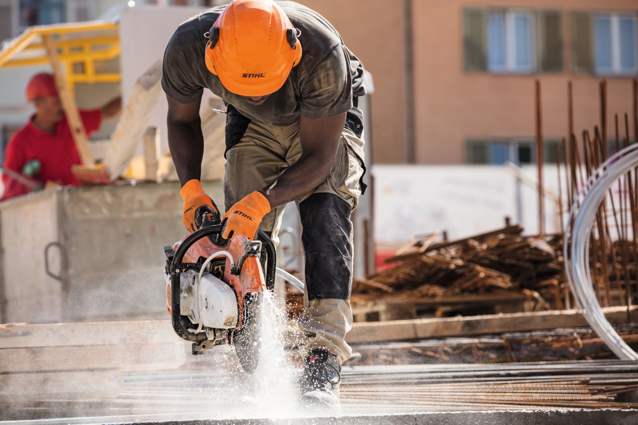 A man working on a construction site with a STIHL TS 500i cut-off machine