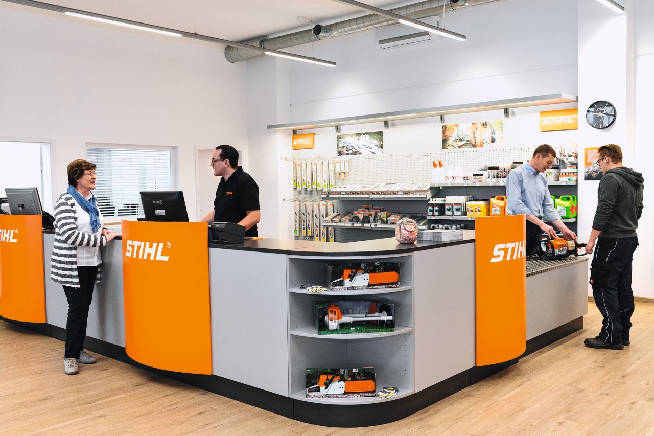 STIHL dealer sales area with employees and customers  