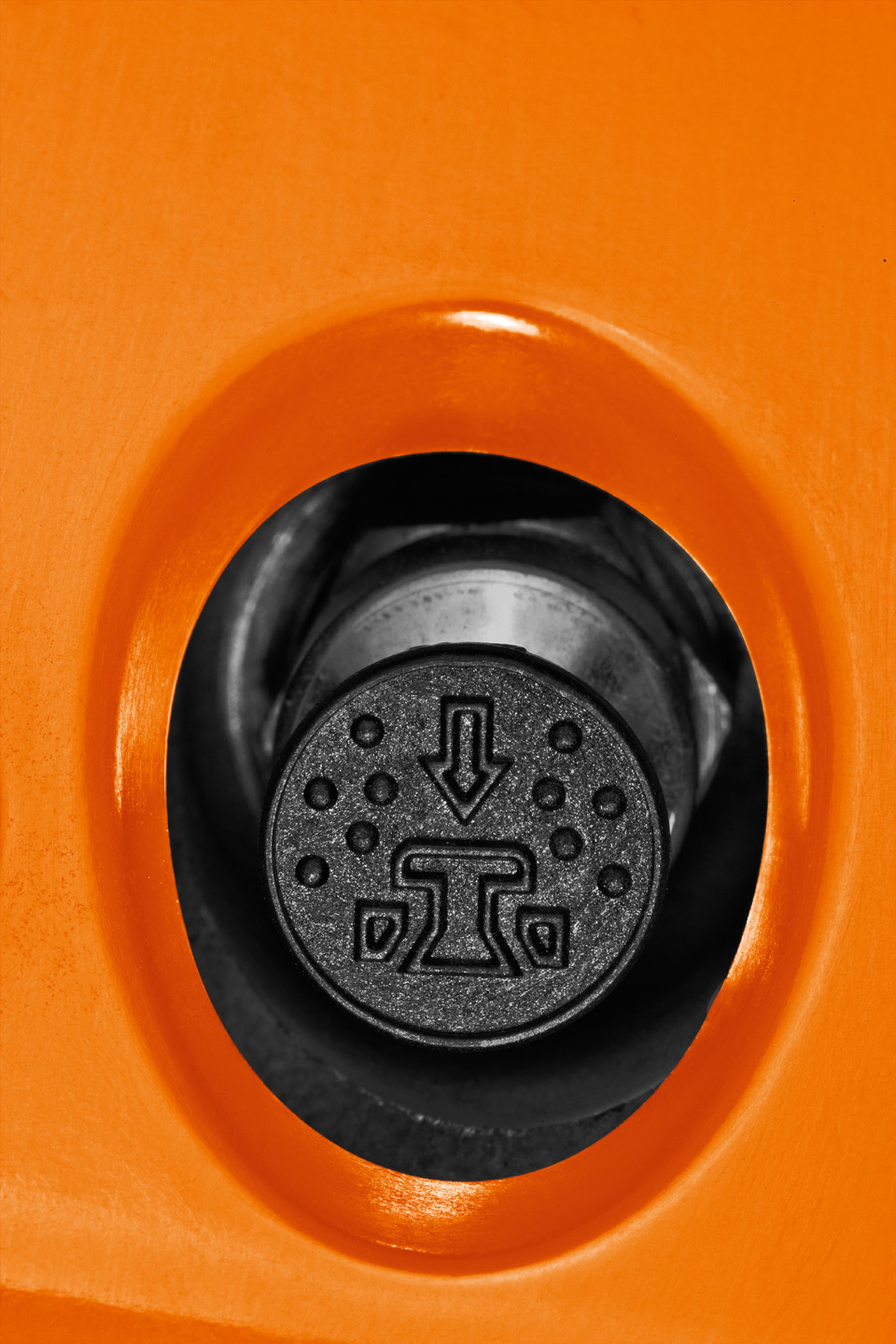 Close-up of a decompression valve on a STIHL petrol chainsaw