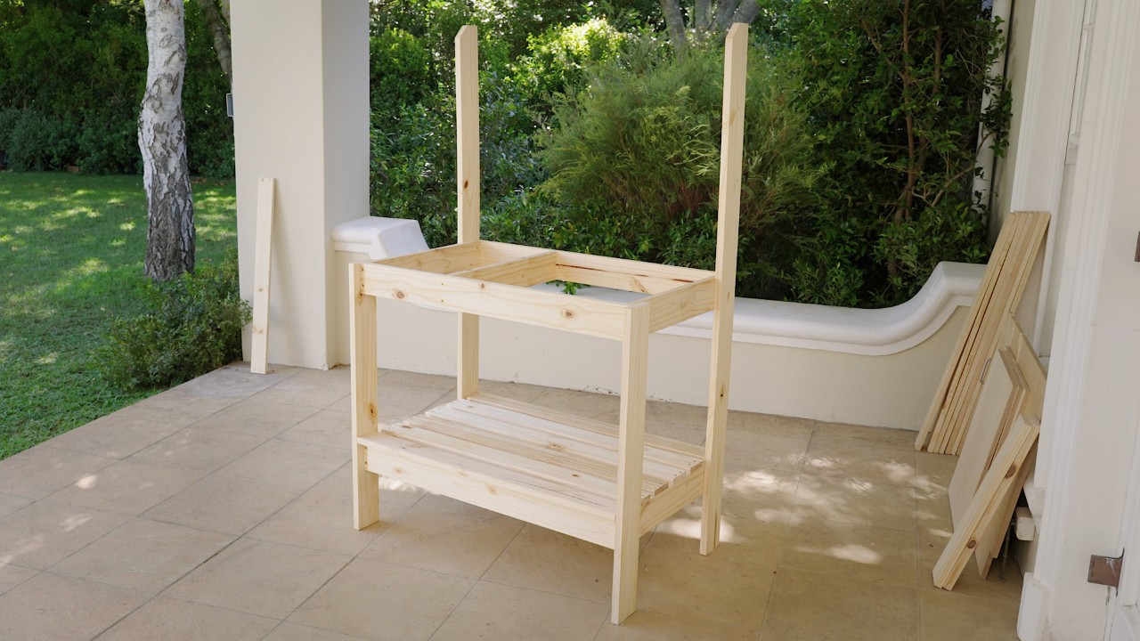 Potting bench on a veranda with newly screwed-on base slats