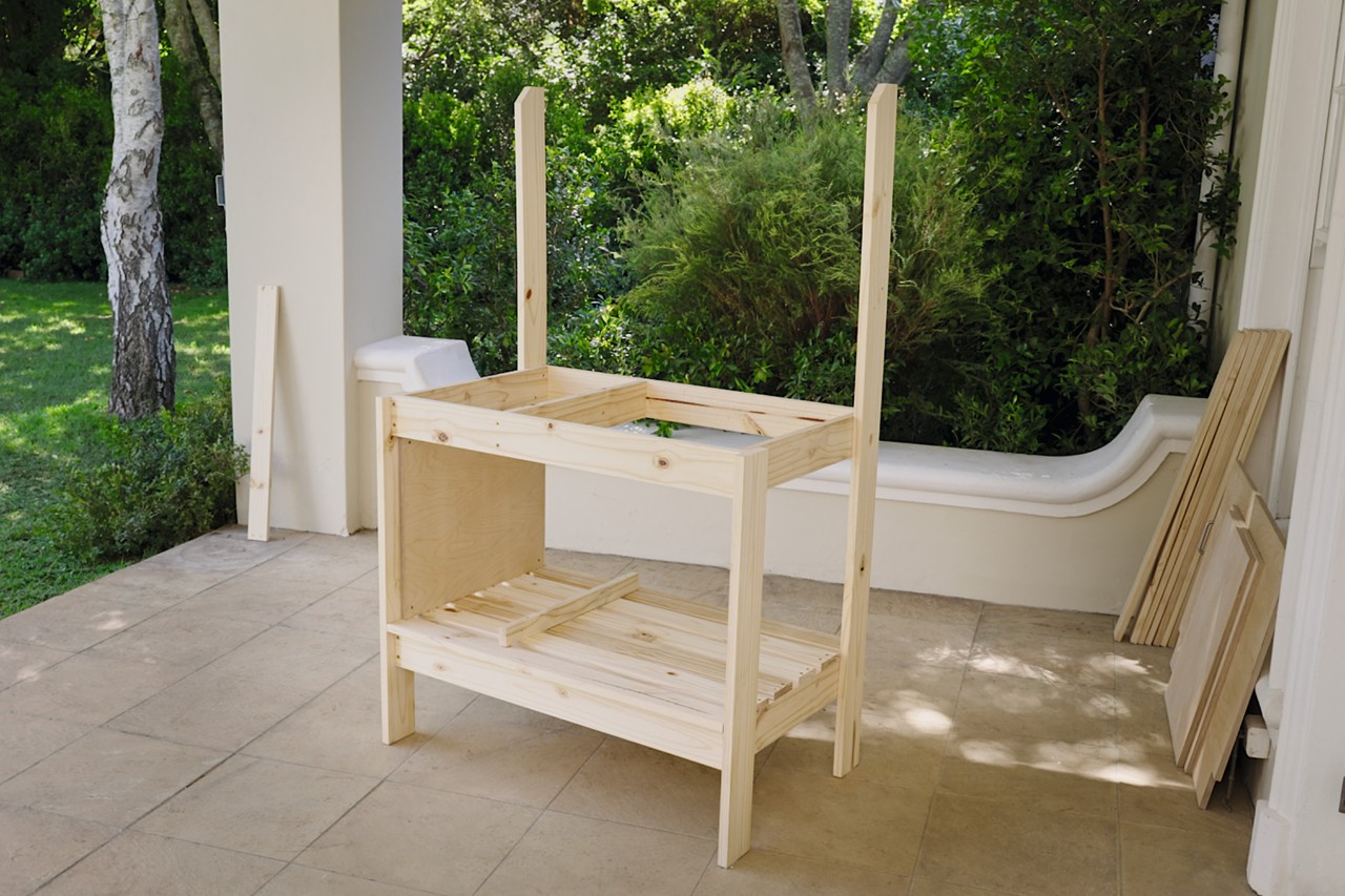 Potting bench with newly fitted bottom rail