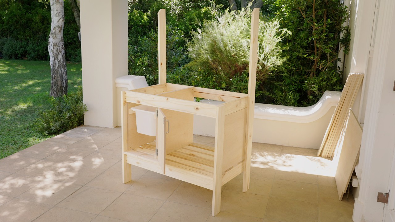 Potting bench with newly attached waste basket