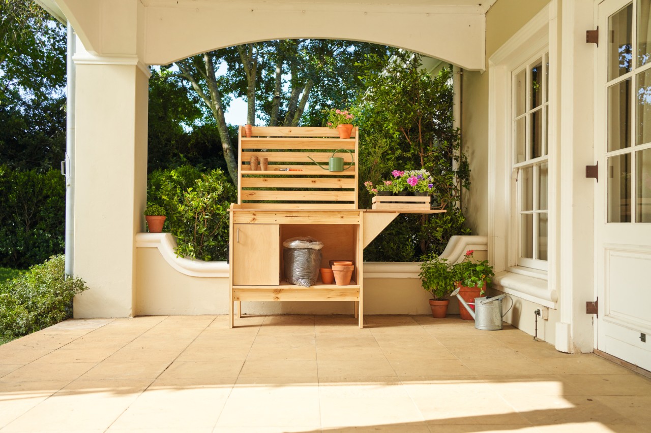 A DIY potting bench on a terrace 