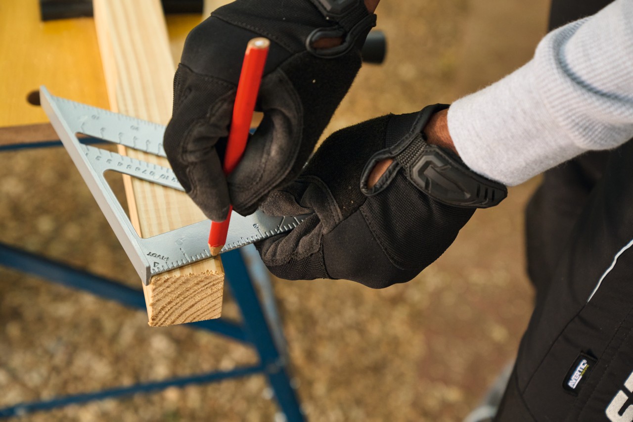 A set square is used to mark bevels on the side struts