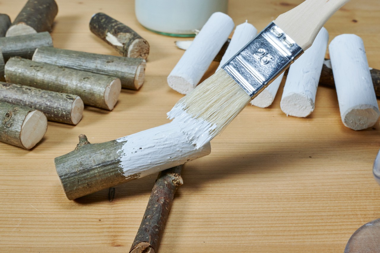 DIY ornamental heart: pieces of wood being painted white