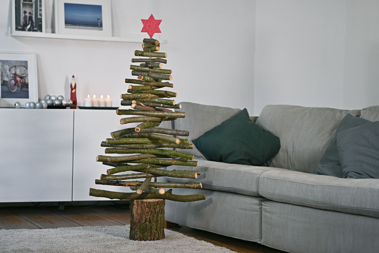 DIY wooden Christmas tree in a room with Christmas decorations