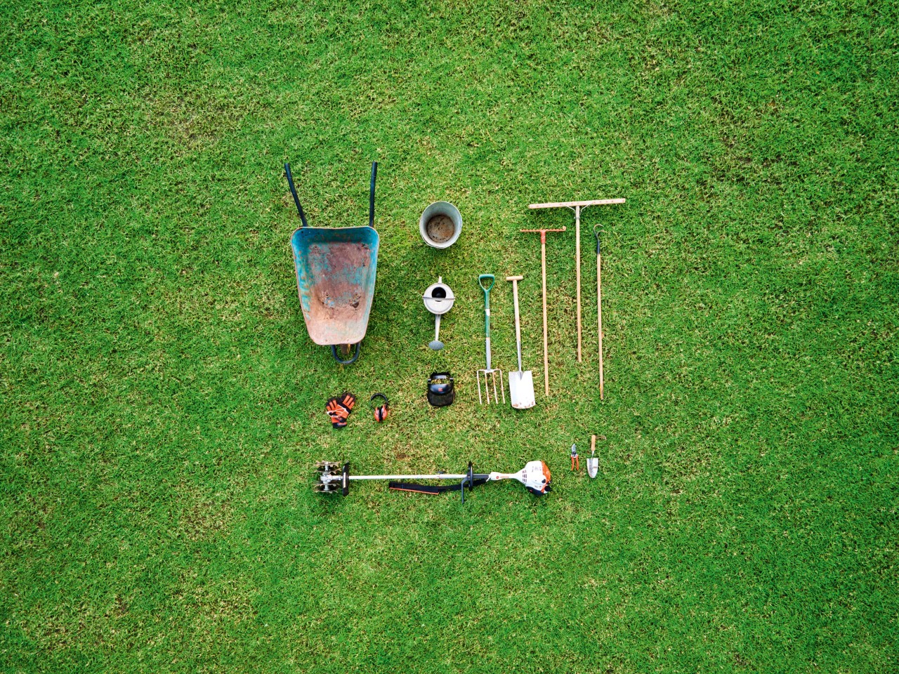 View from above of the power tools required to plant ground cover, including a STIHL KM 56 RC-E CombiSystem