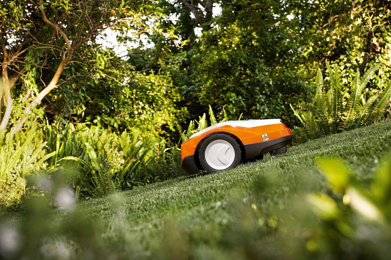 The iMOW® STIHL RMI 522 robotic lawn mower on a steep slope